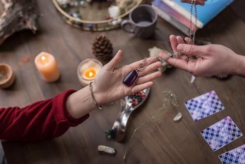 Powerful,Talisman.,Top,View,Of,A,Female,Hand,Above,The
